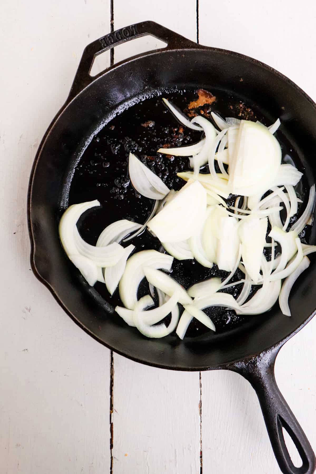 raw onions in a cast iron skillet.