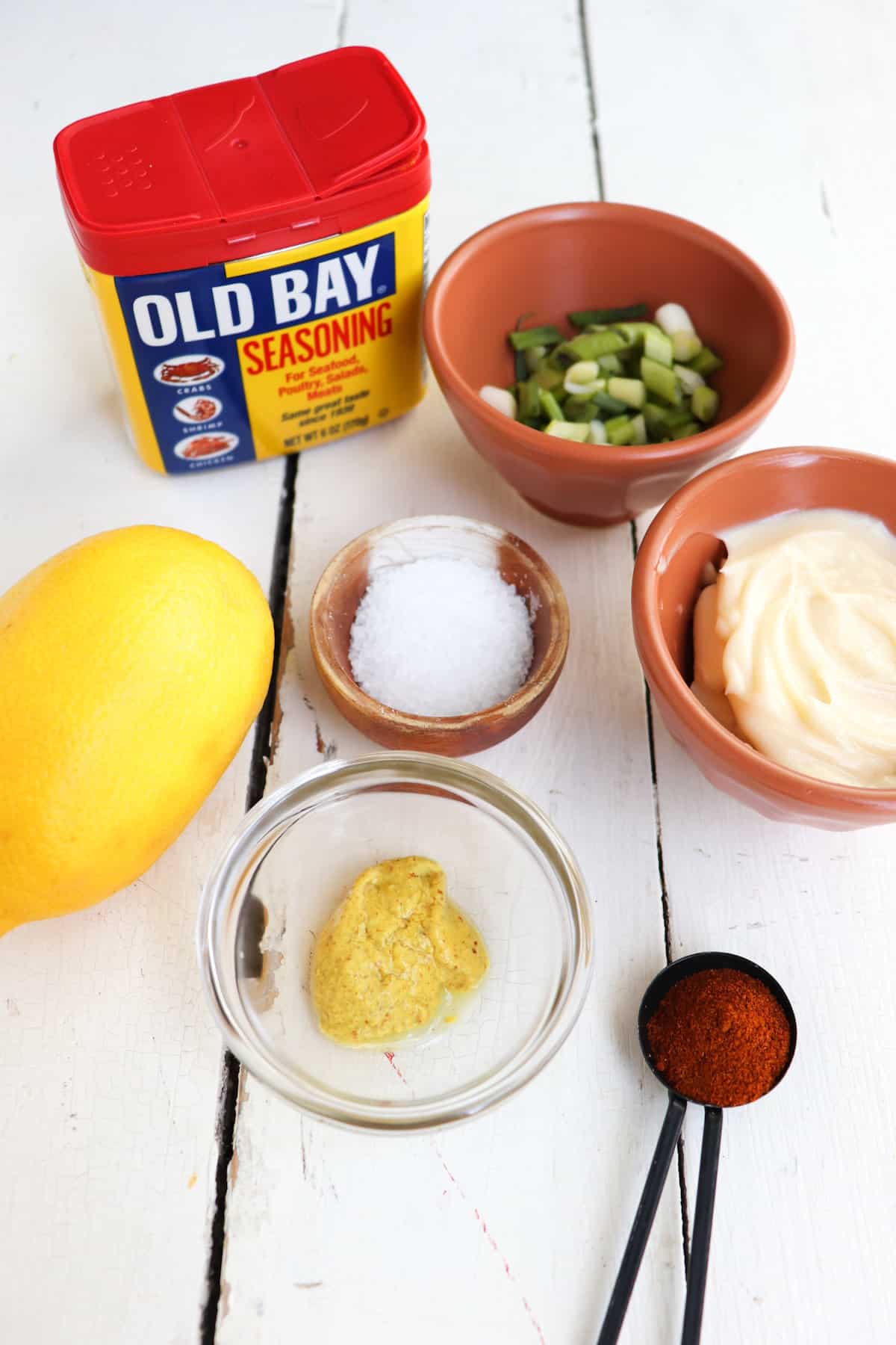 ingredients for remoulade crab cake sauce on a white background.