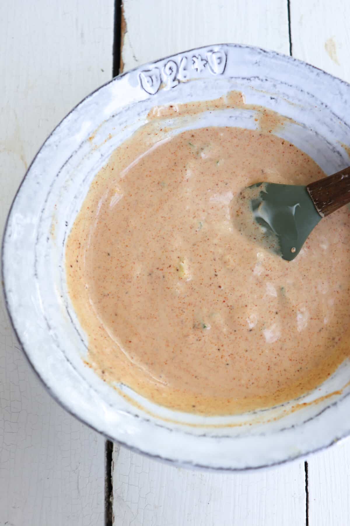 crab cake sauce in a white bowl.