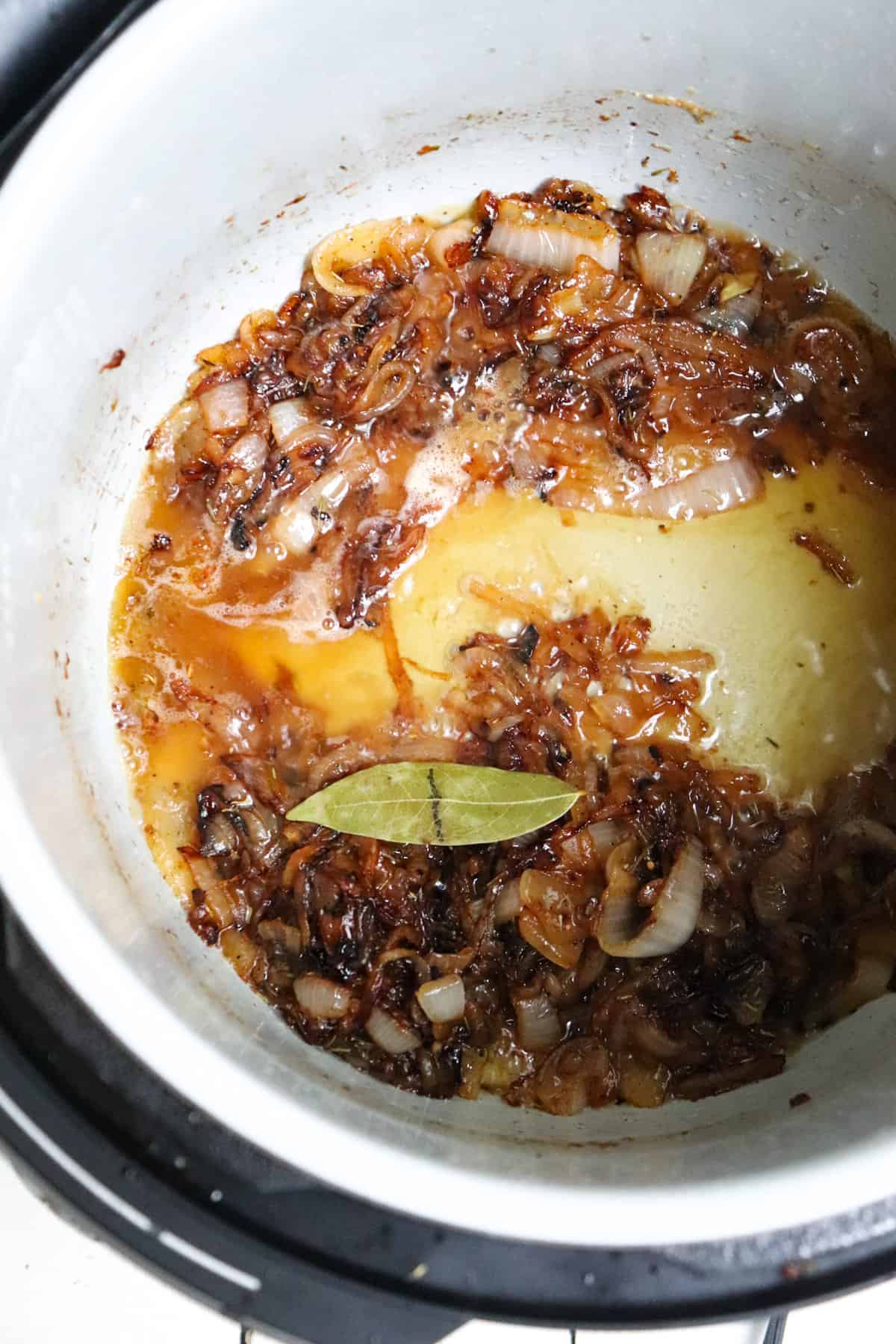 caramelized onions with brandy added and bay leaf in instant pot.