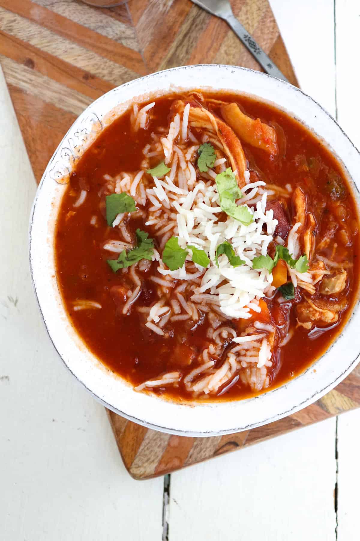 chicken and sausage gumbo in a white bowl.