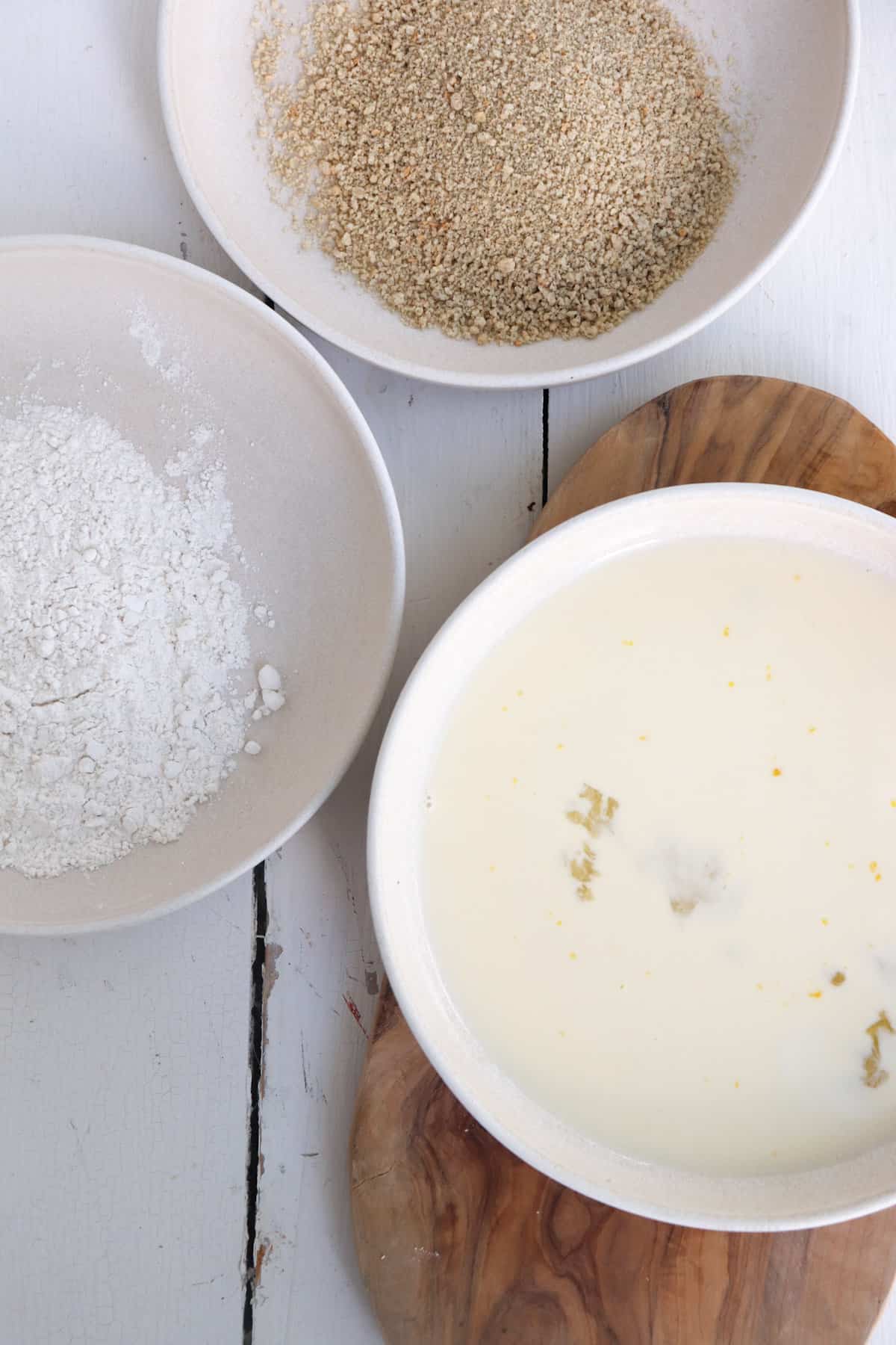flour, breadcrumbs, and egg wash, in separate bowls.