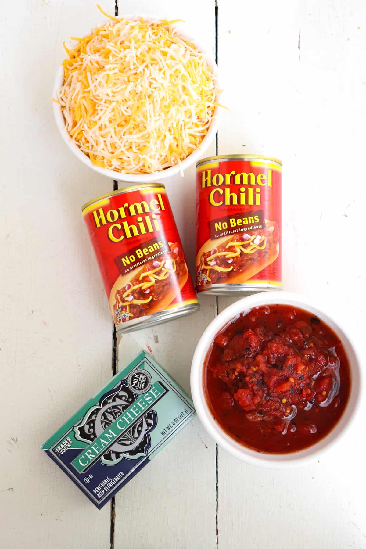 ingredients for crock pot chili cheese dip on a white background.