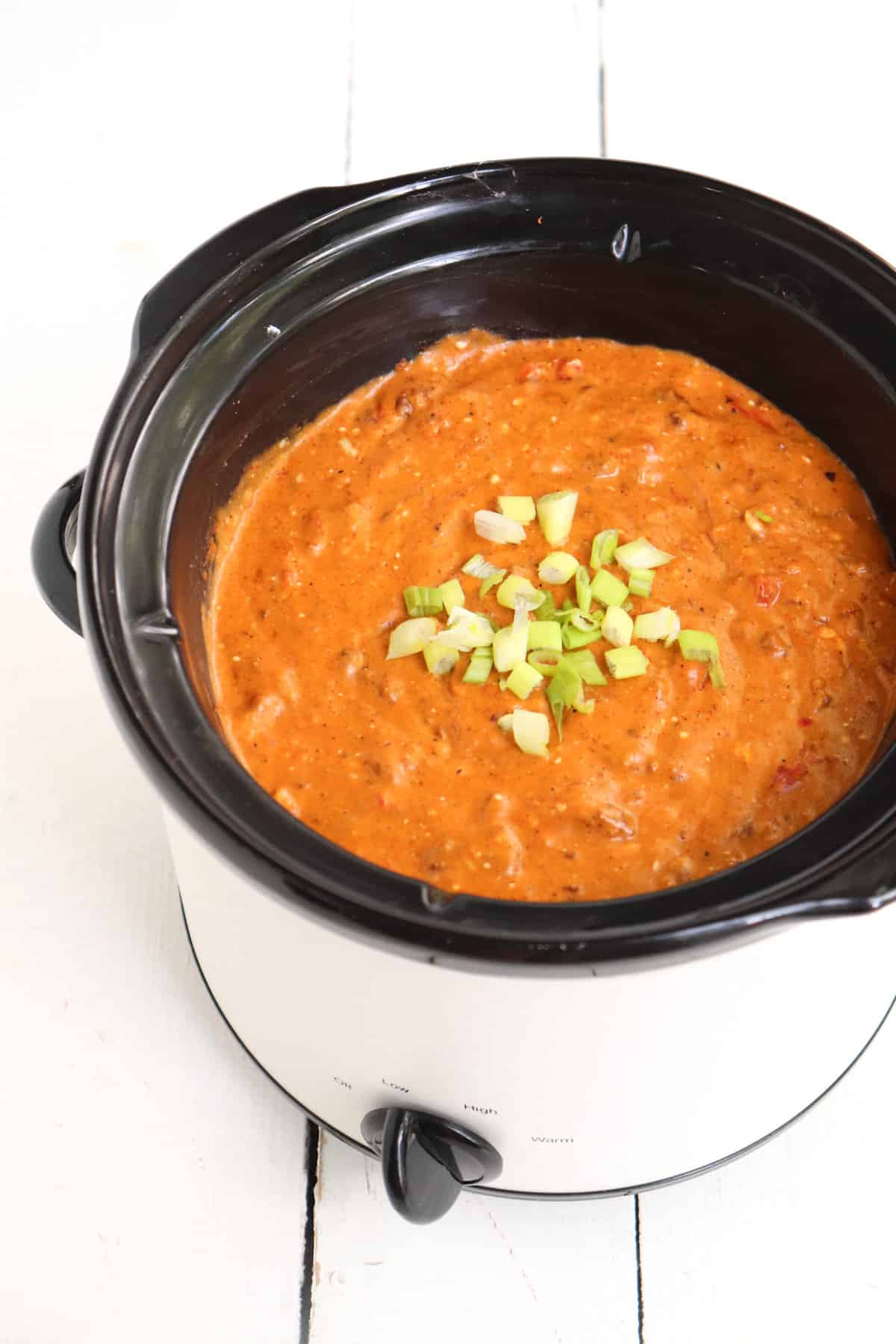 crock pot full of cheese dip. 