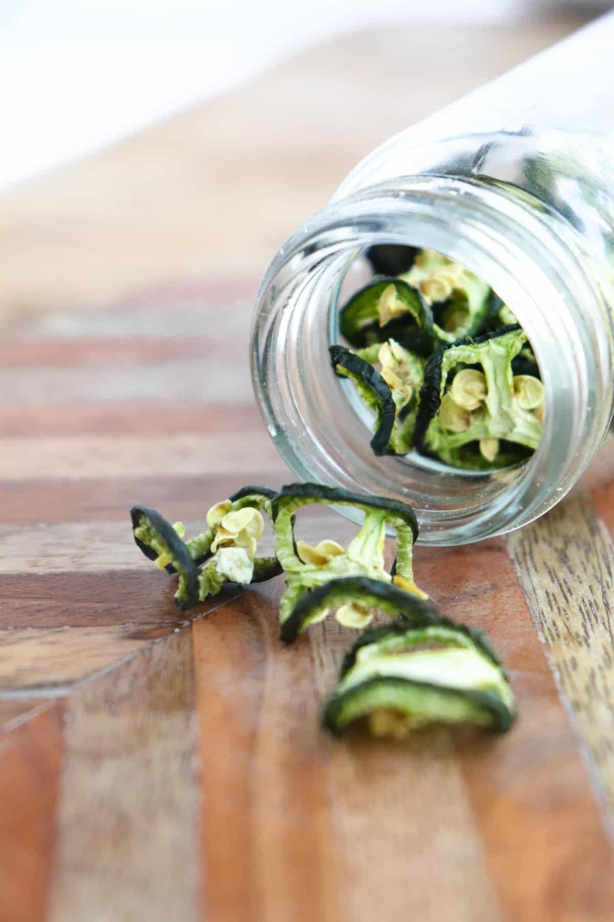jar tipped over with dehydrated jalapenos spilling out.