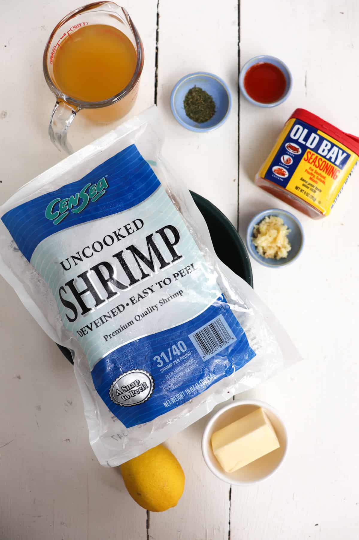 ingredients for instant pot shrimp on a white background.