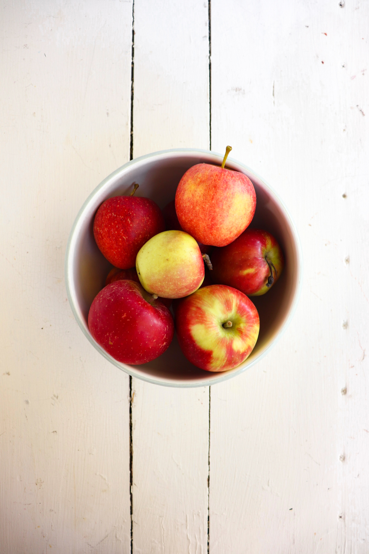 bowl of fresh red and yellow apples.