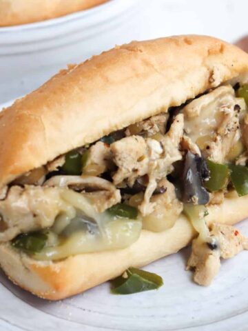 chicken philly sandwich on a plate.