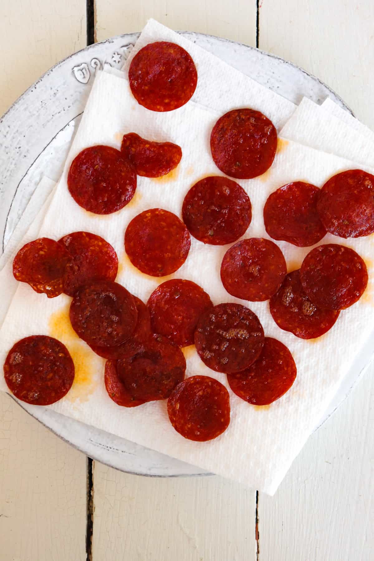 cooked pepperoni on a paper towel.
