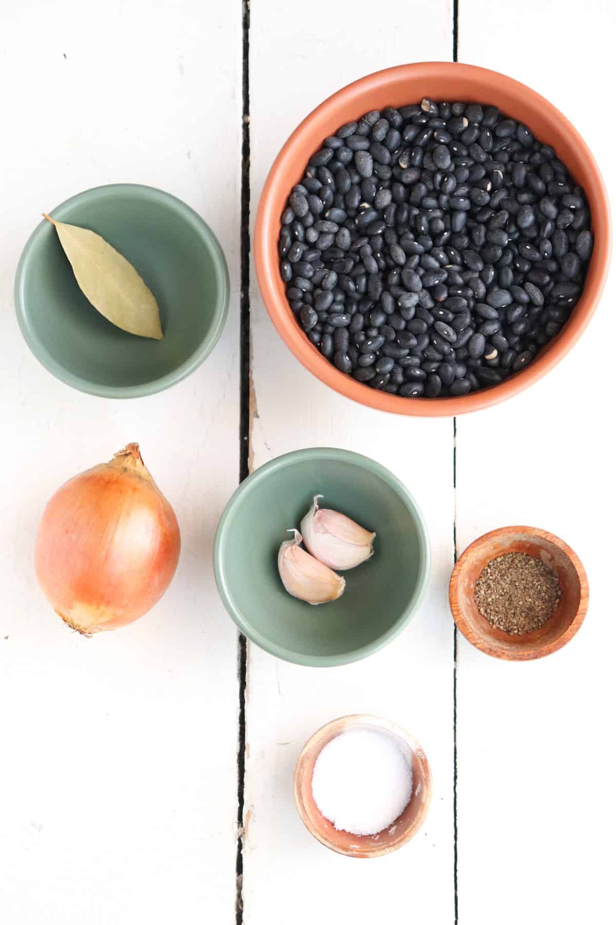 ingredients for instant pot black beans on a white background.