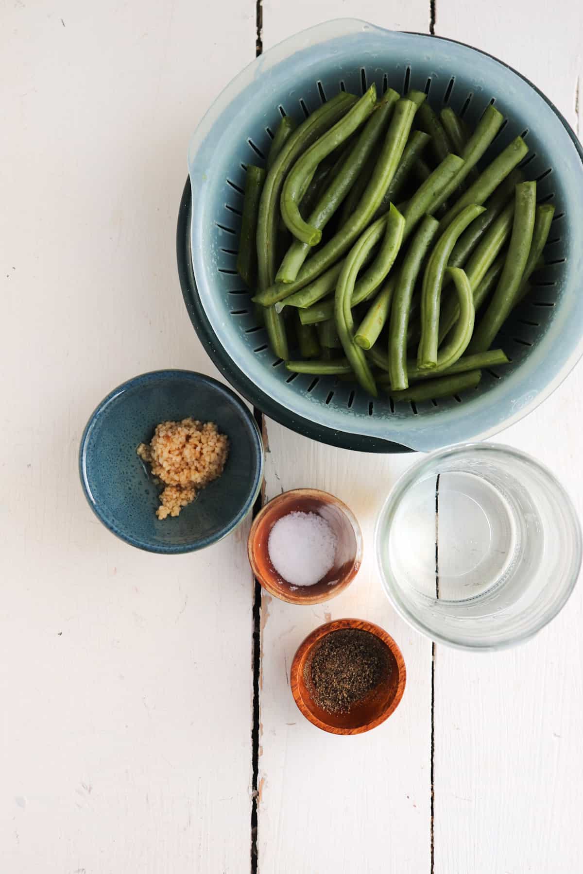 ingredients for instant pot green beans on a white background.