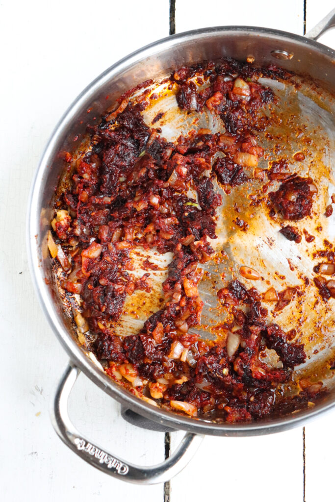 caramelized tomato paste in a pan.