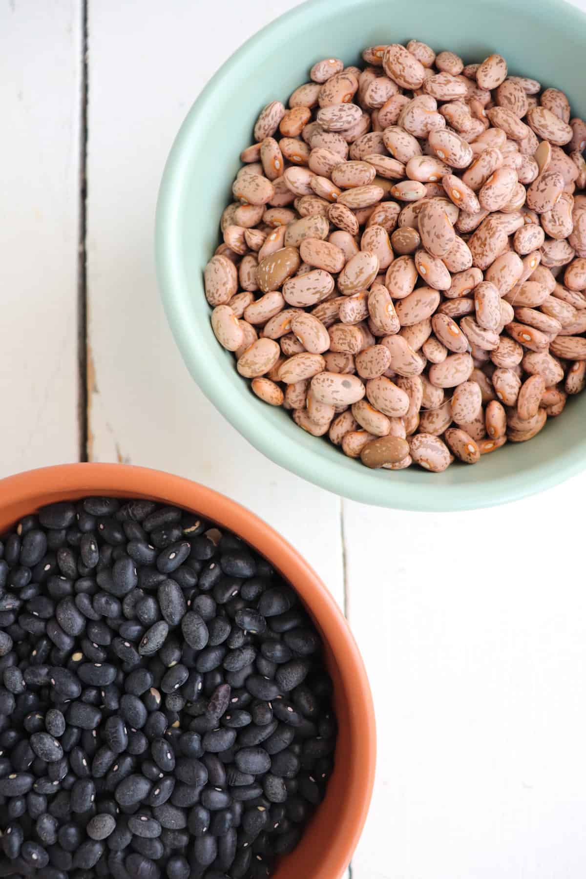 two bowls of dried beans.