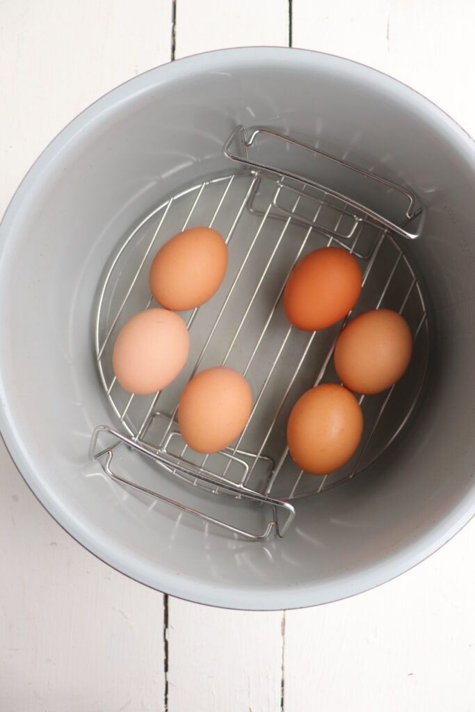 6 eggs on metal trivet.