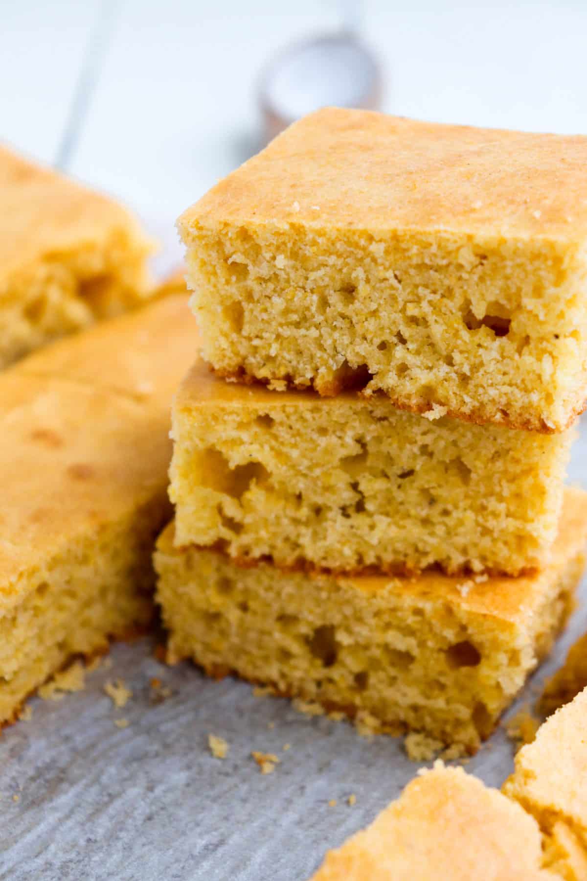 stack of three slices of cornbread from an angle.