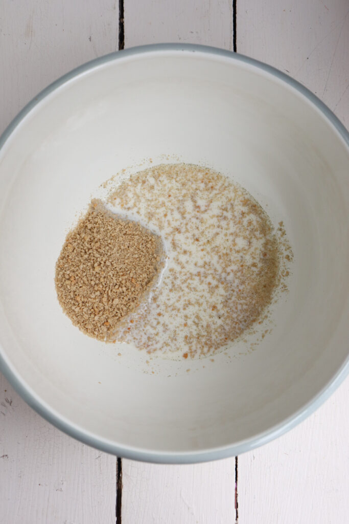 milk and breadcrumbs in a mixing bowl.