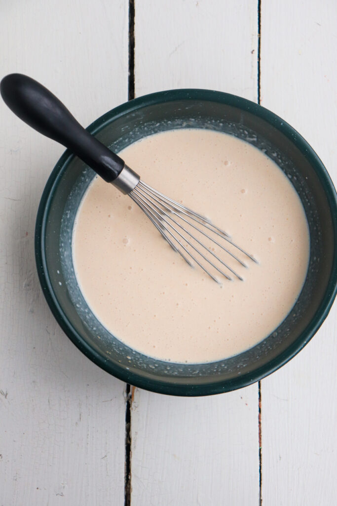 peanut butter ice cream base with whisk.