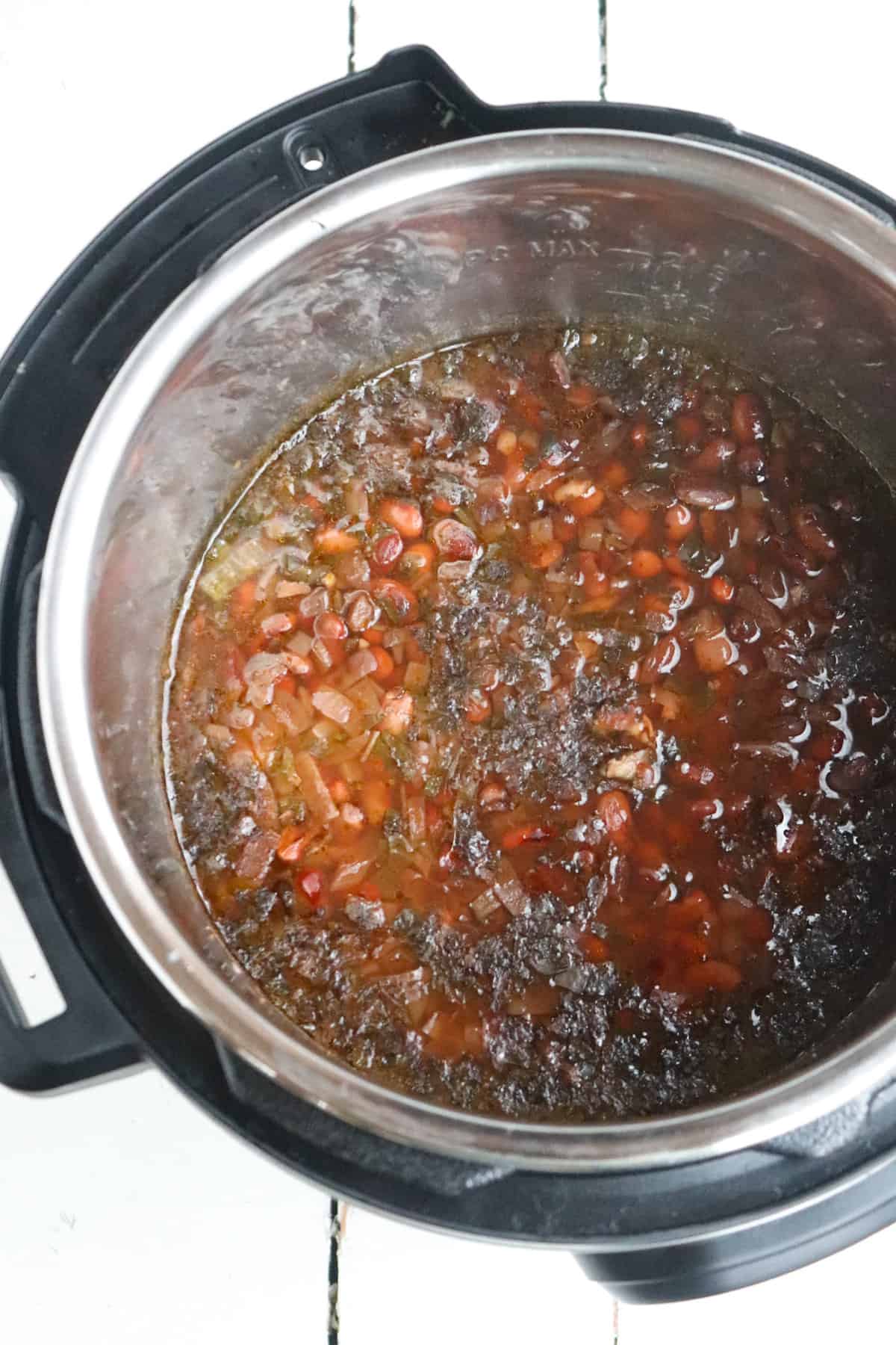 cooked pinto beans in pressure cooker before being drained.