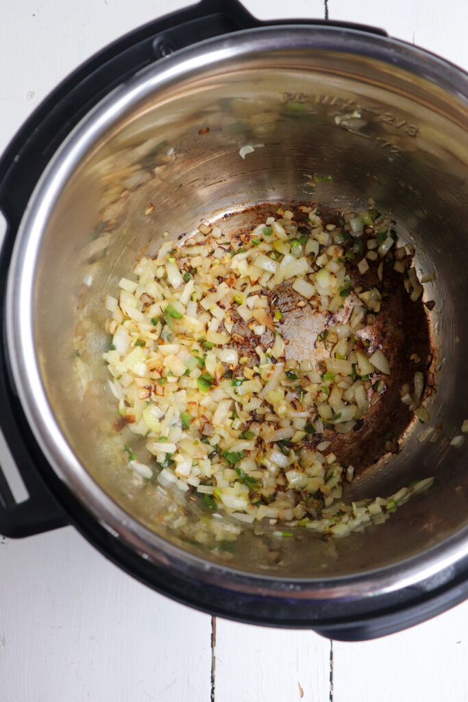 onions and jalapenos sauteing in oil.