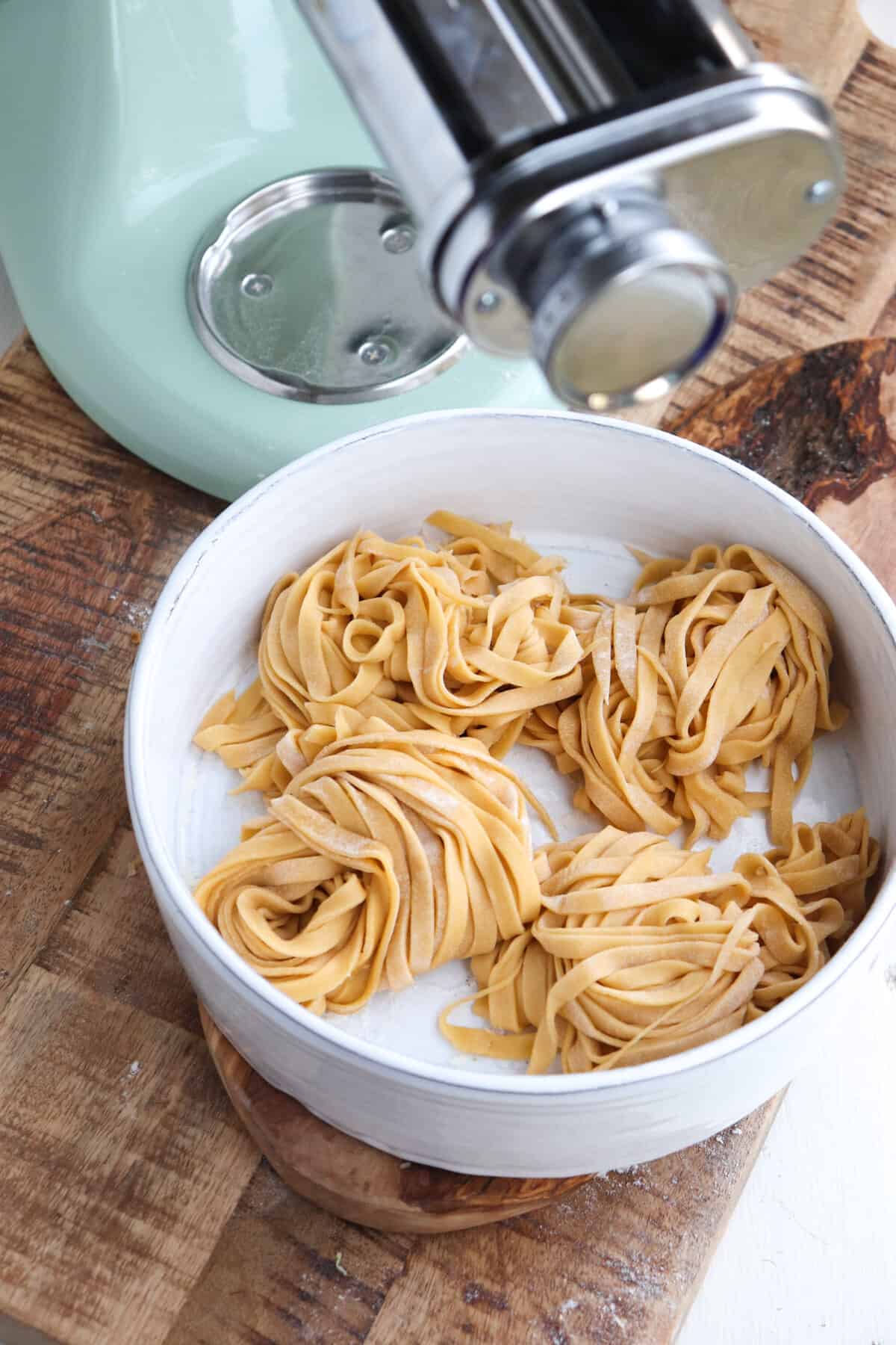 4 nests of fresh pasta in front of kitchenaid mixer.