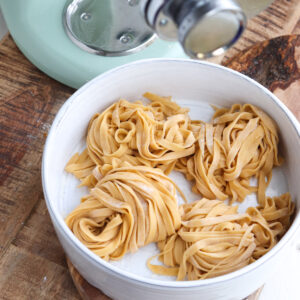 4 nests of fresh pasta in front of kitchenaid mixer.