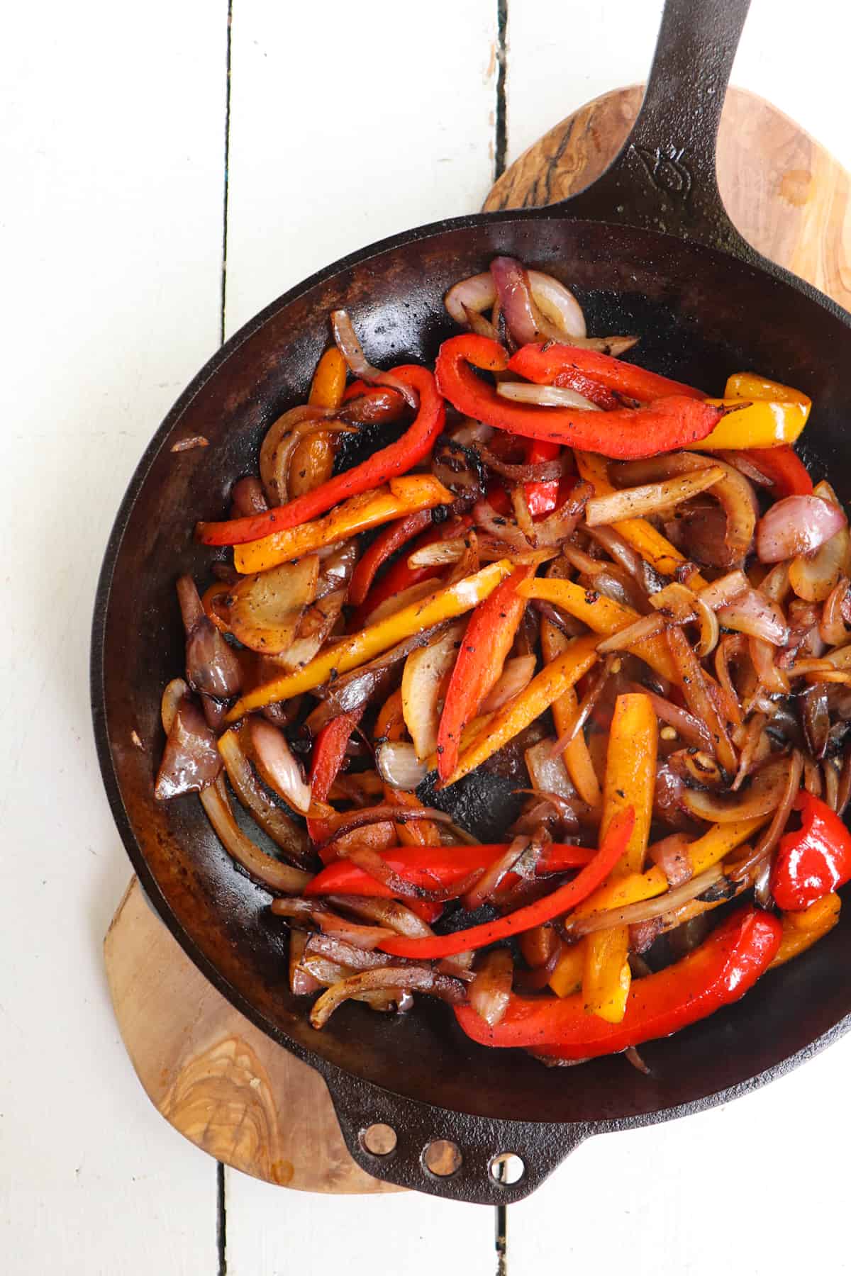 peppers and onions cooked in skillet.