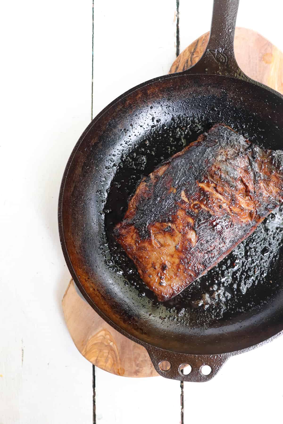 flank steak seared in cast iron skillet.