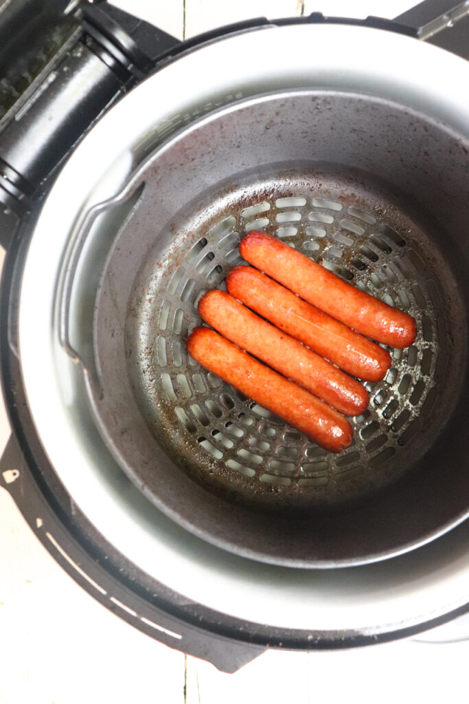 hot dogs cooked in ninja foodi basket.