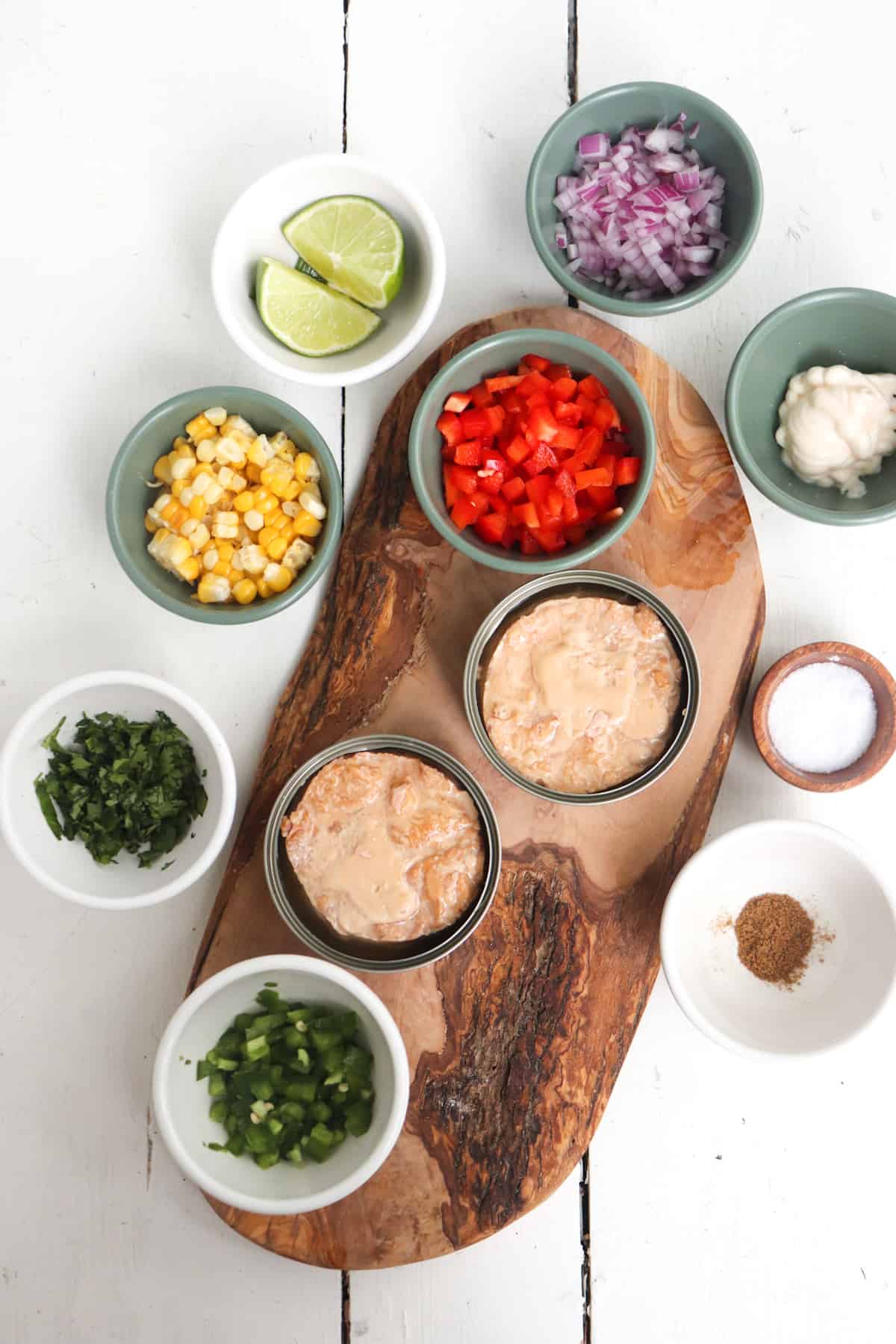 ingredients for mexican tuna salad on a wooden background.