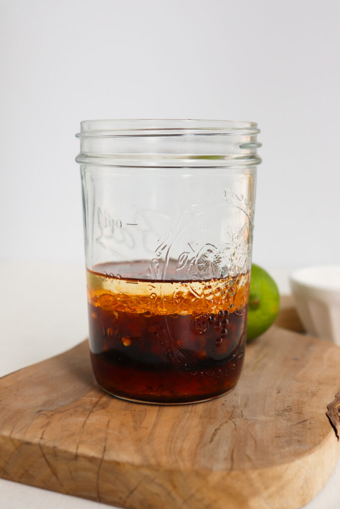 liquids for marinade added to a jar.