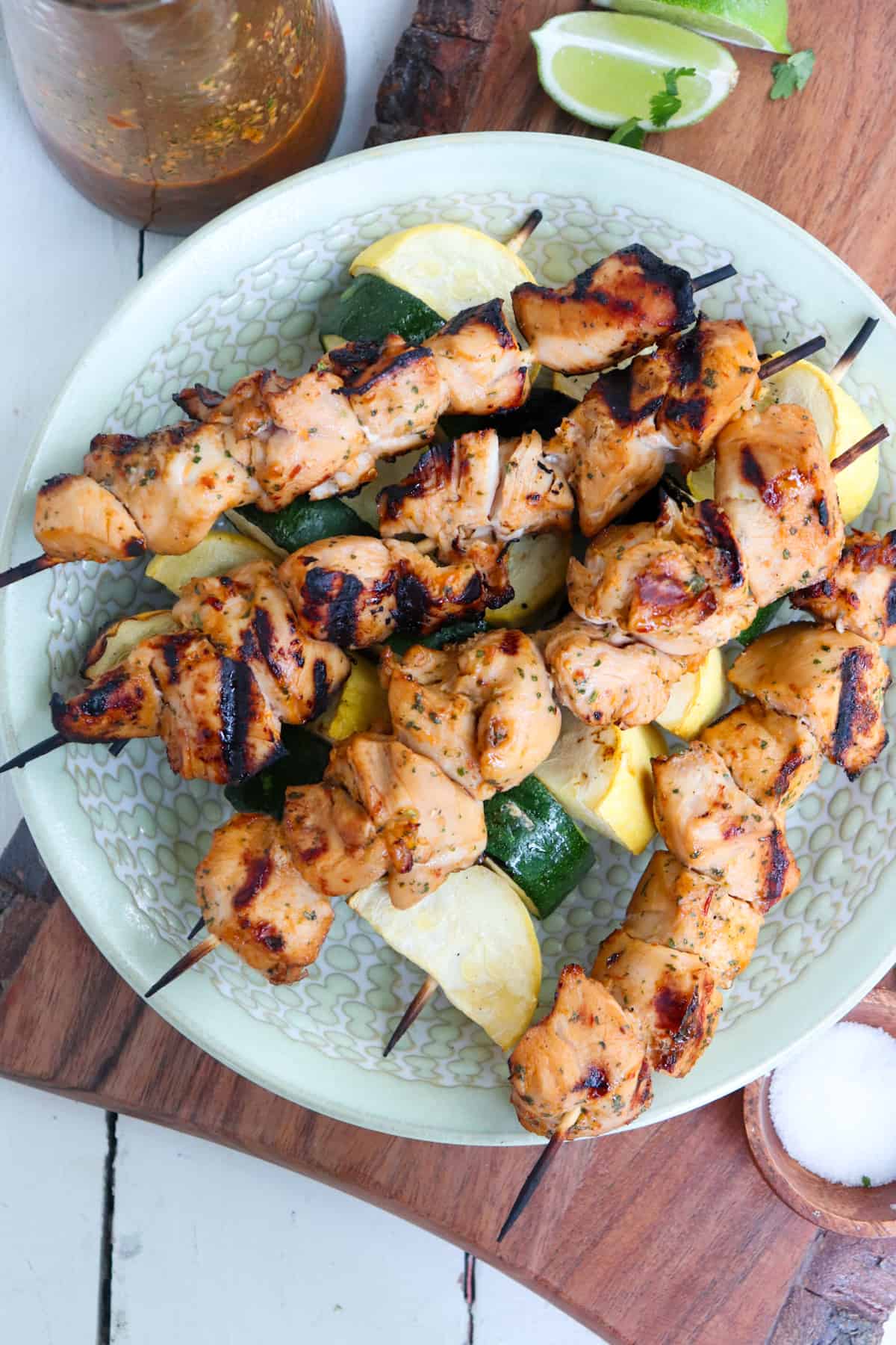 chicken and zucchini kabobs on a plate.