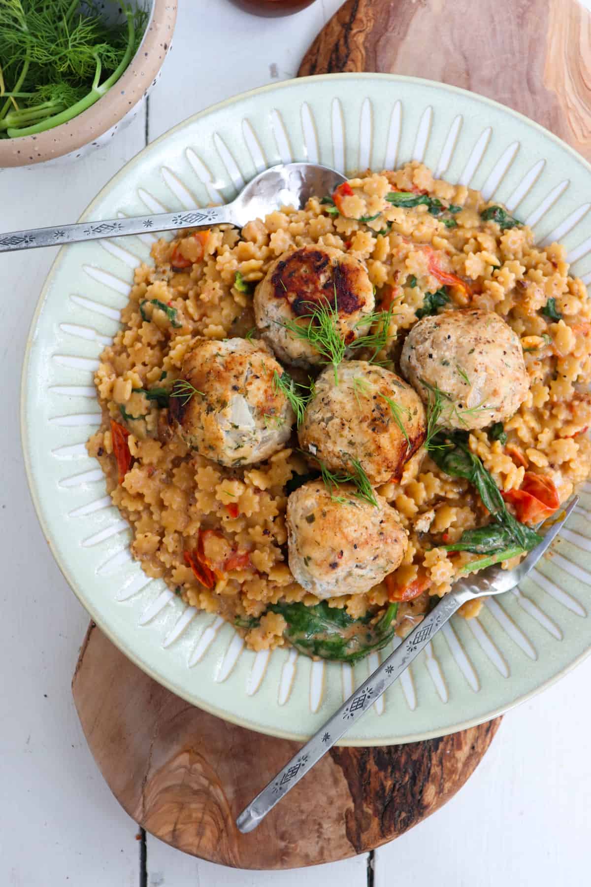 greek chicken meatballs plated with pastina.