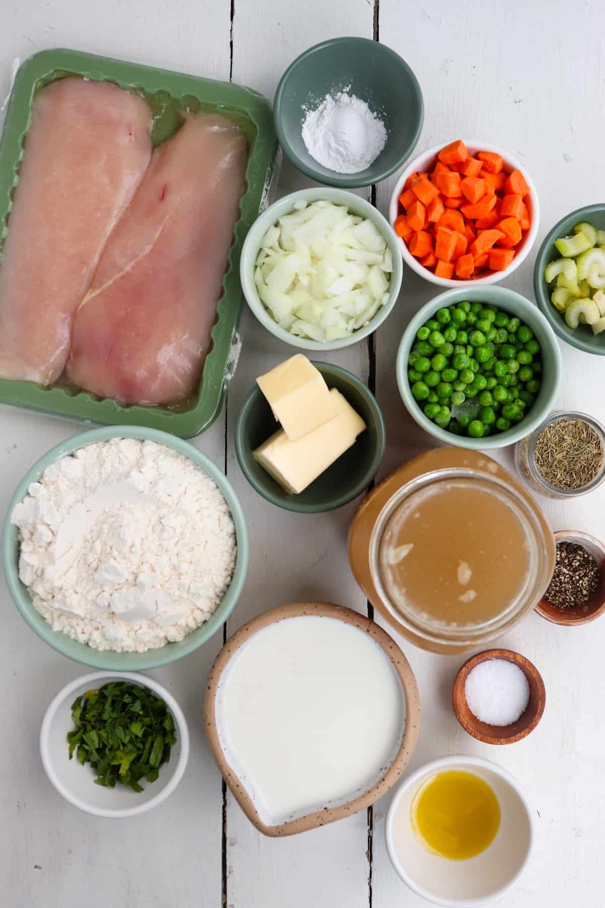 ingredients for chicken and dumplings on a white background.
