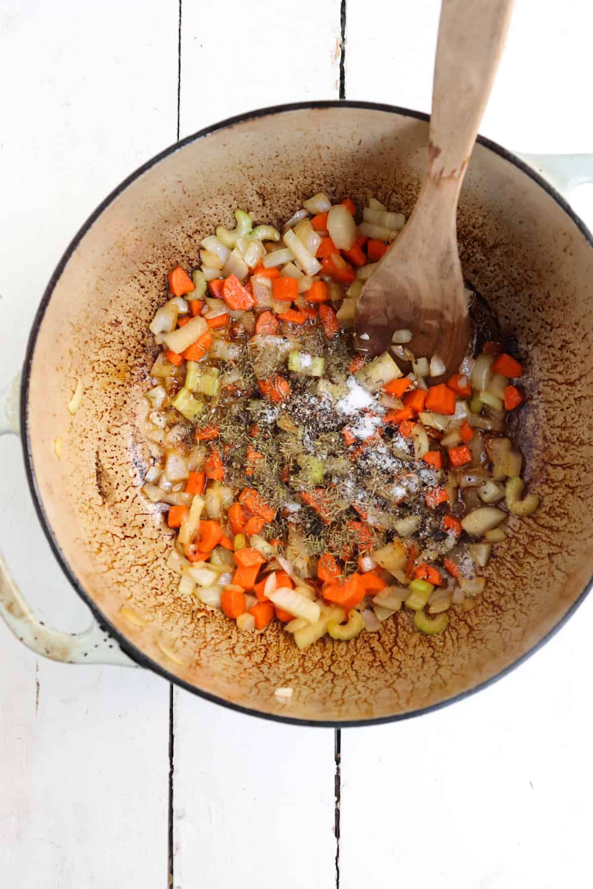 spices added to sauteed mirepoix in pot