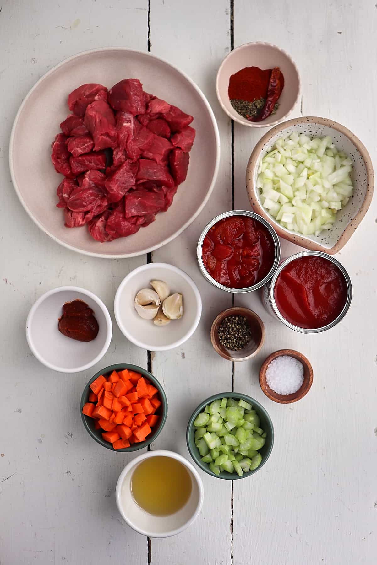 ingredients for african beef stew on a white background.