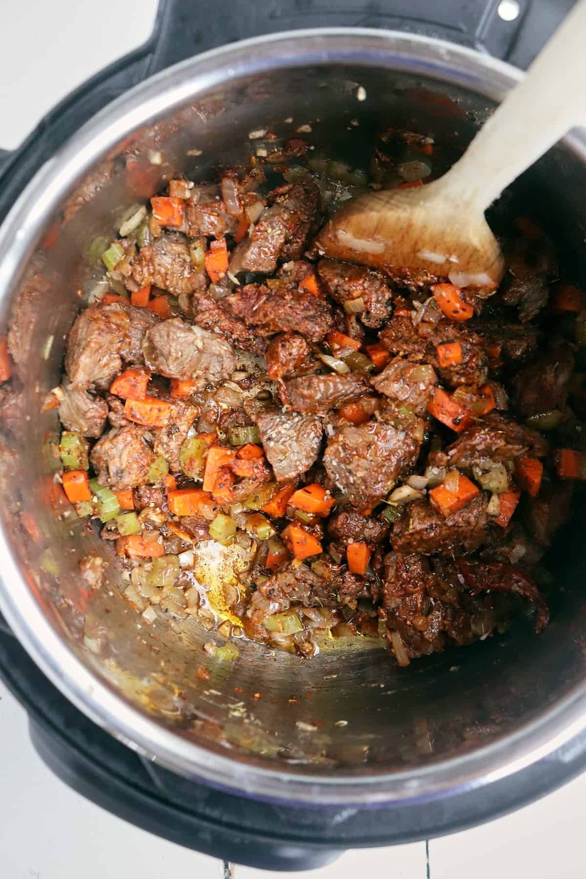 spices browned in the instant pot with meat and veggies.