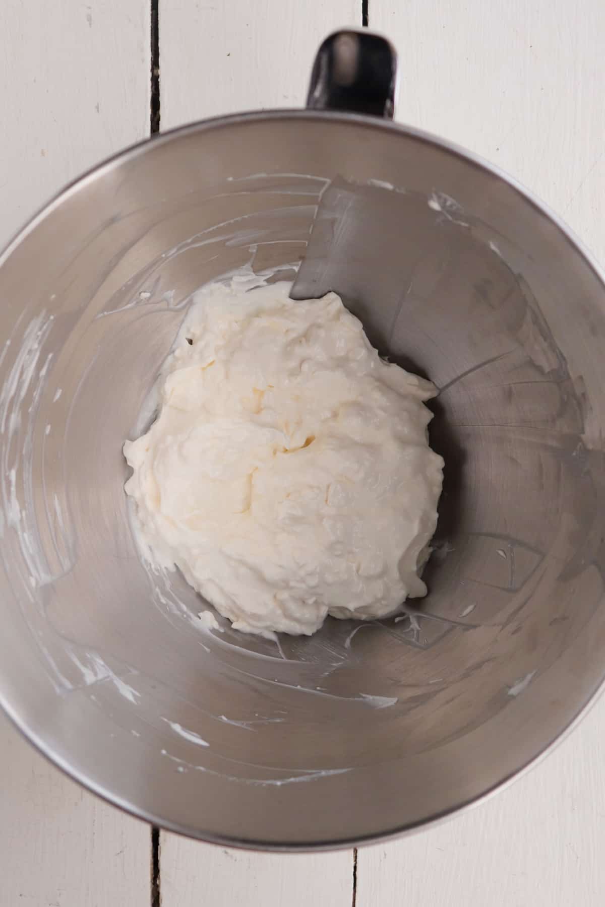 cream cheese and greek yogurt combined in bowl of stand mixer.