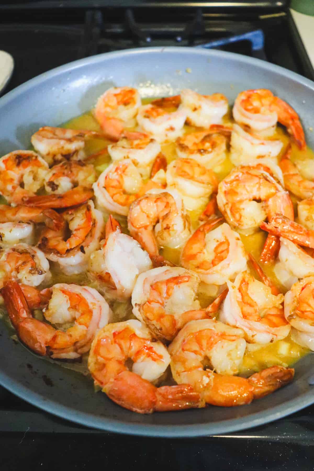 cooked jumbo shrimp in garlic butter sauce.