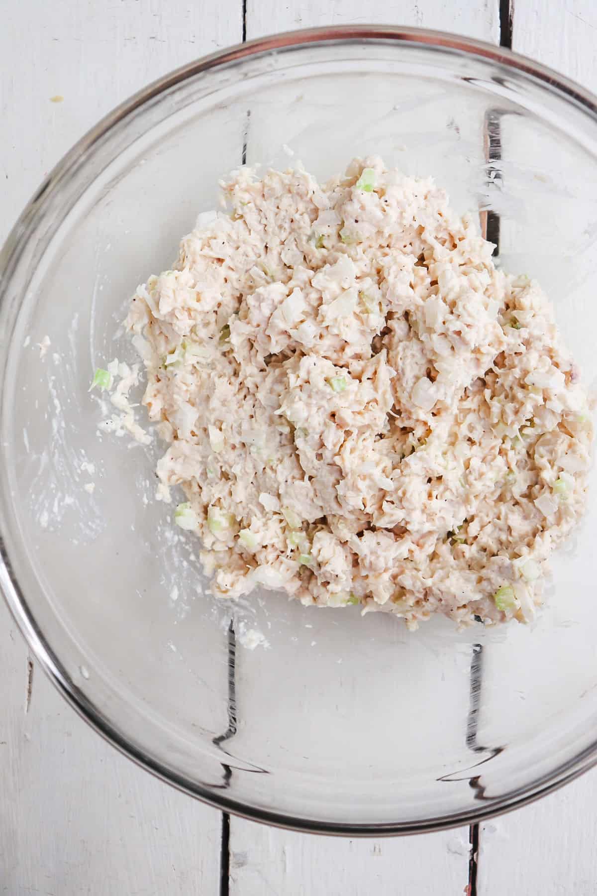 clear mixing bowl with dixie chick chicken salad.