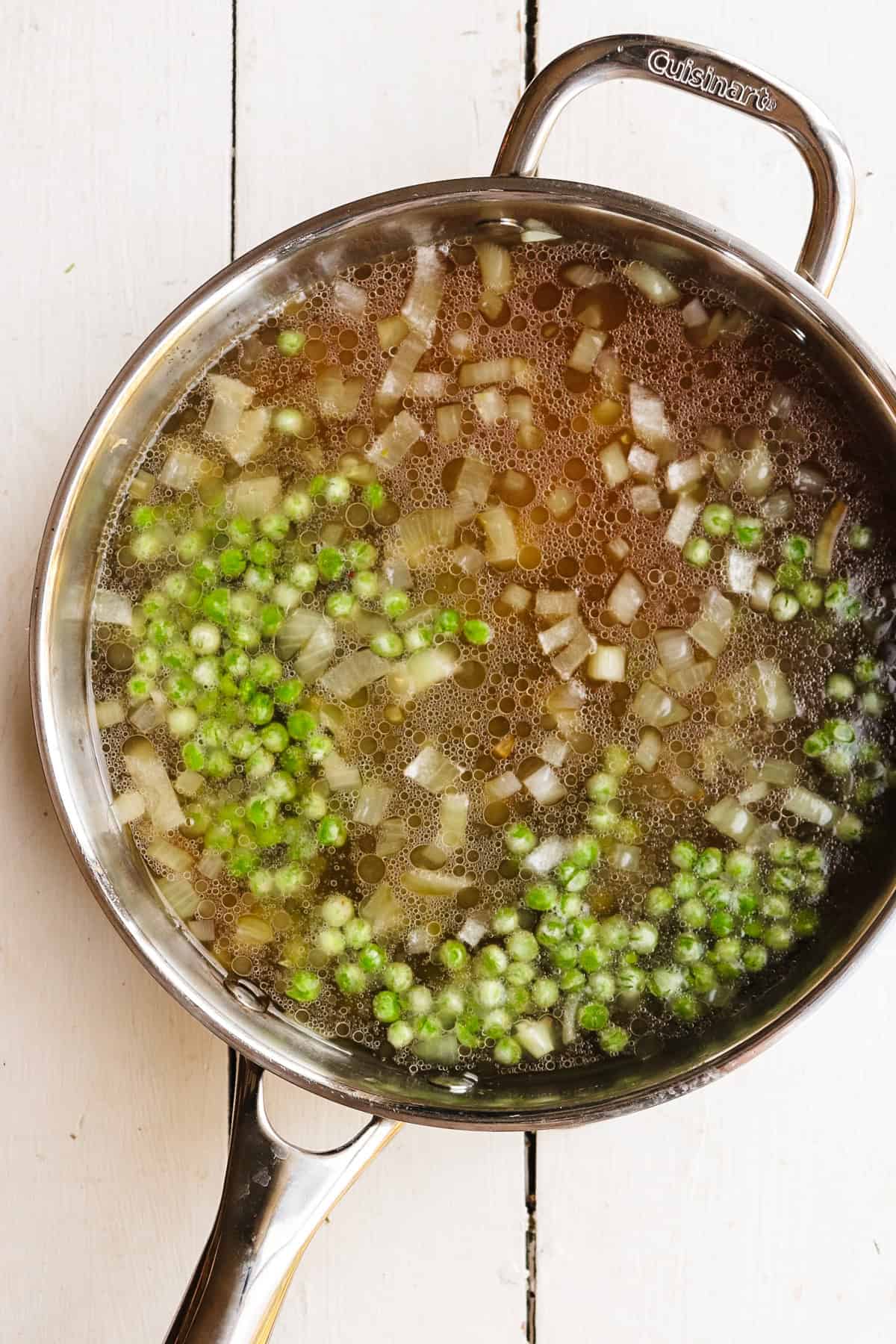 peas and pasta added to broth.