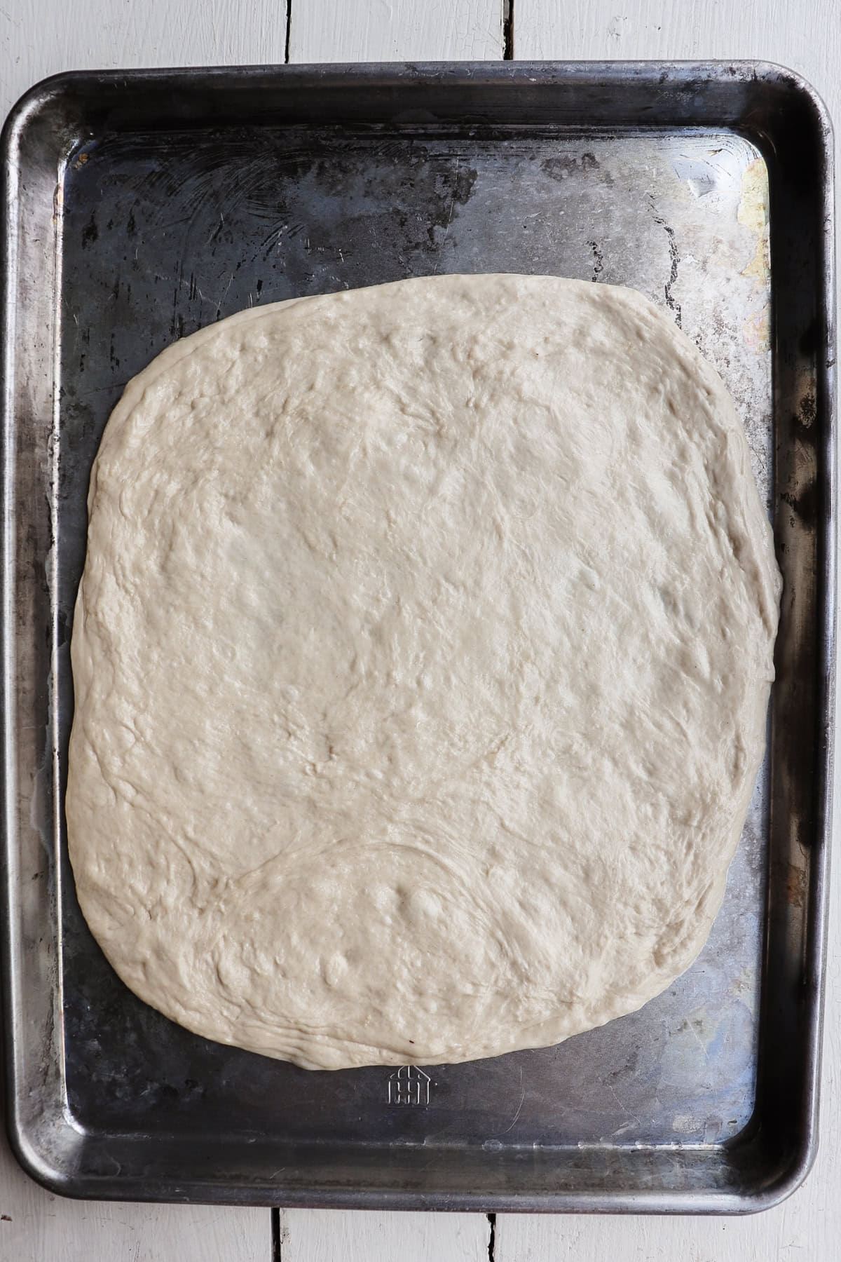 rolled out pizza dough.