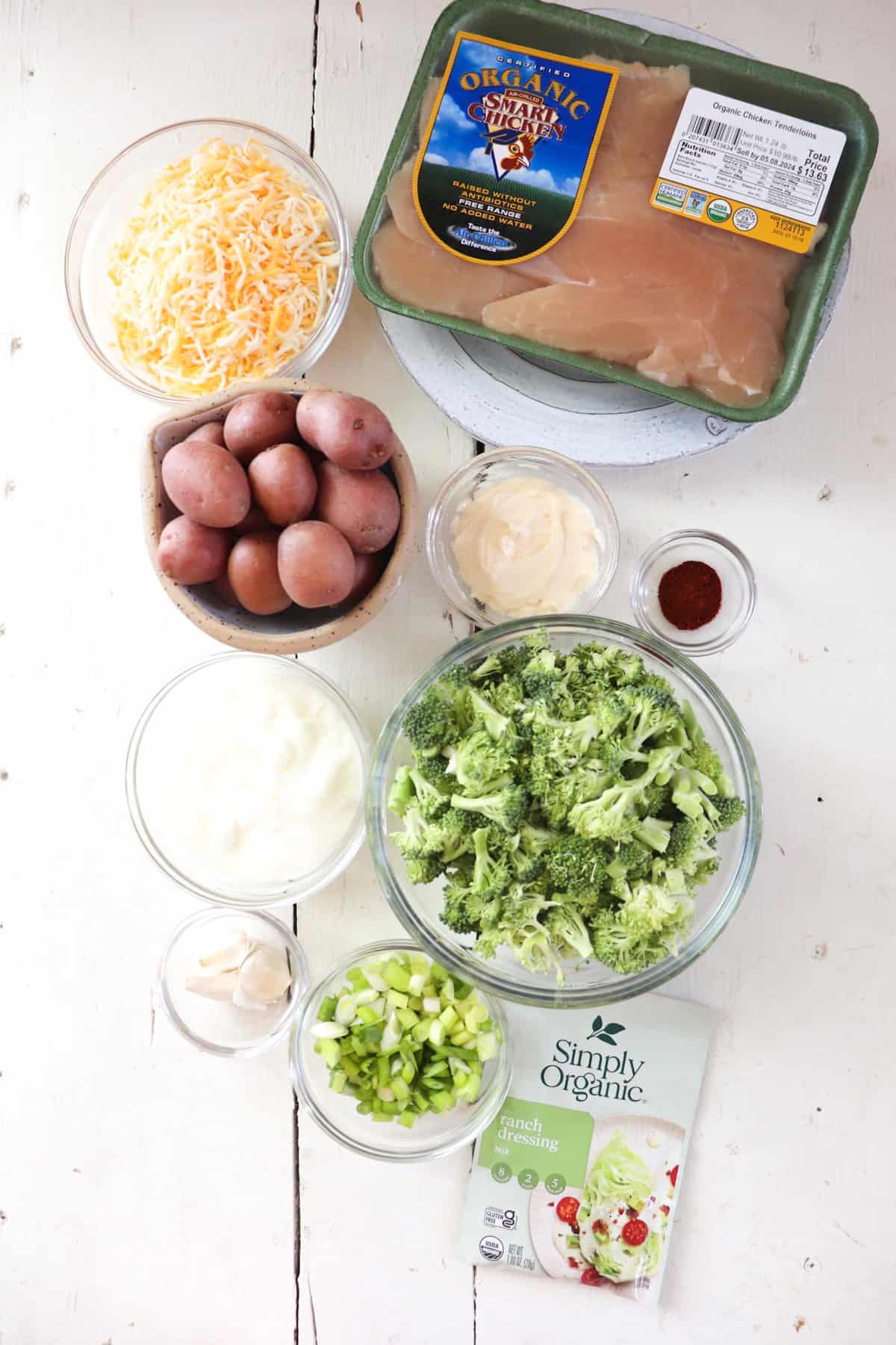 ingredients for chicken potato broccoli casserole on a white table. 