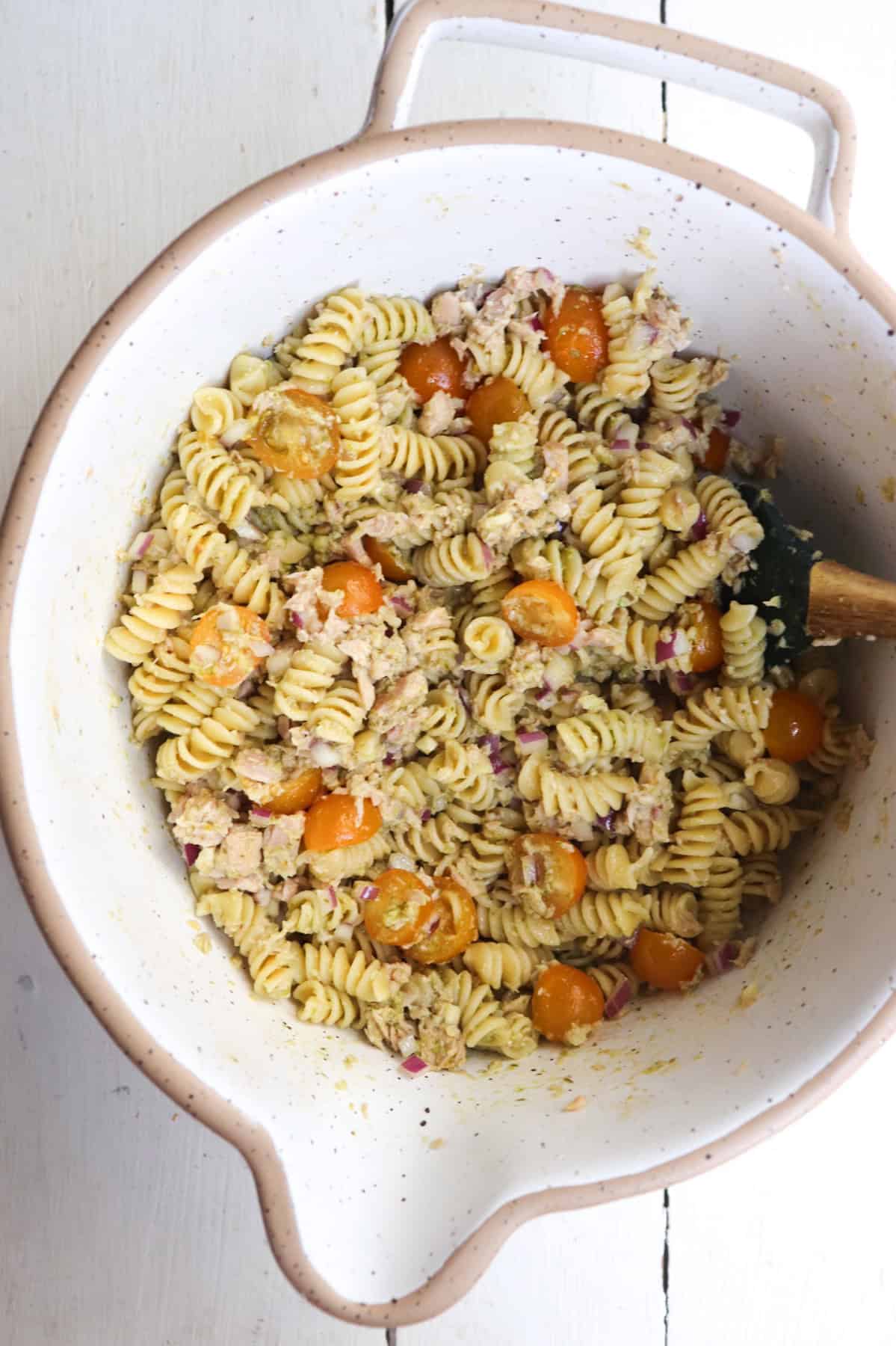 mixing bowl with finished pasta dish.