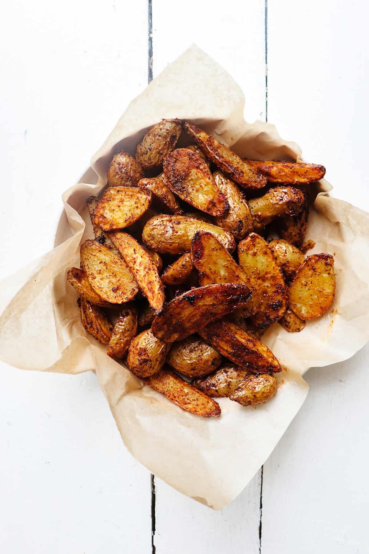 Potatoes in bowl without garnish.