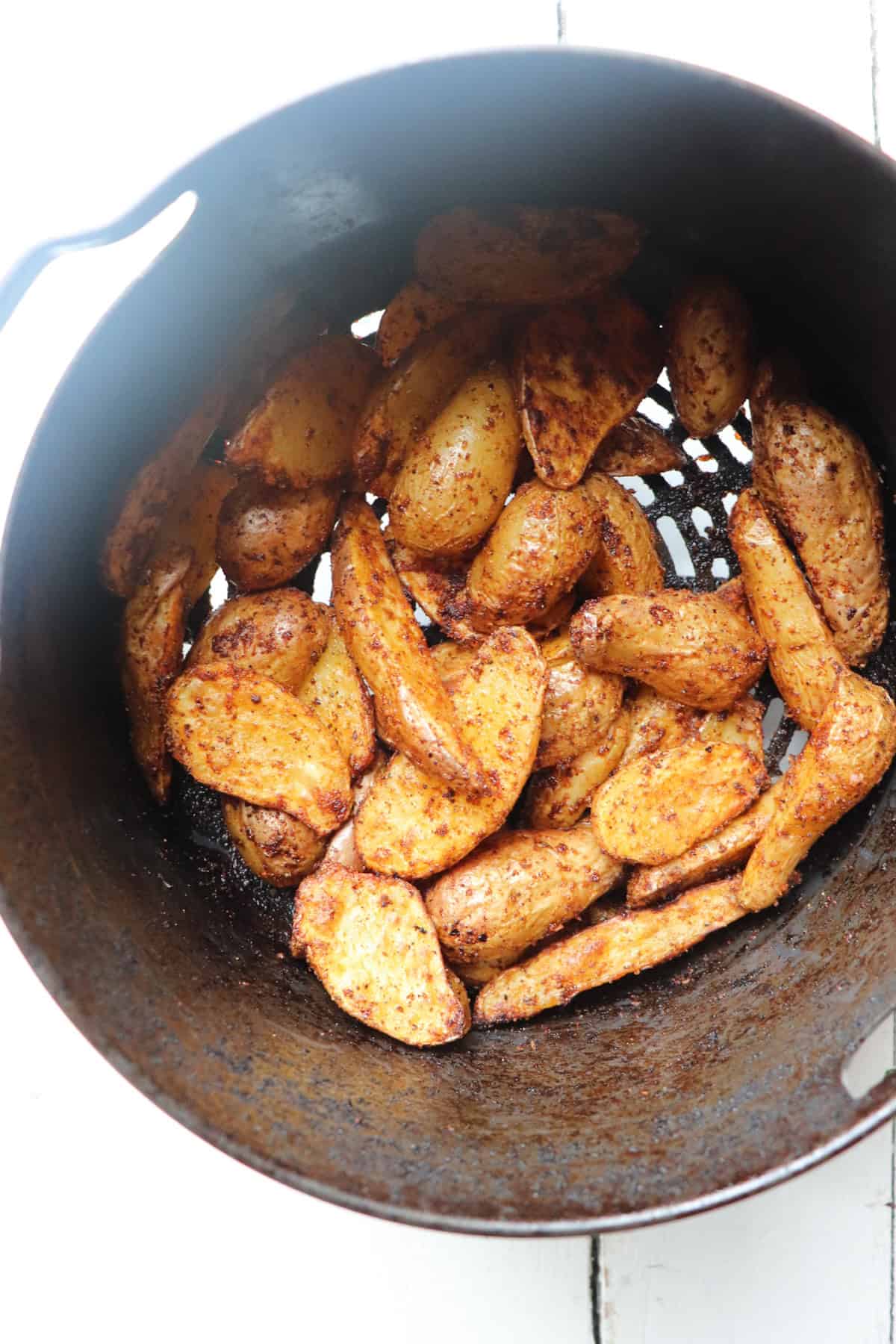 Fingerling potatoes cooking in the air fryer.