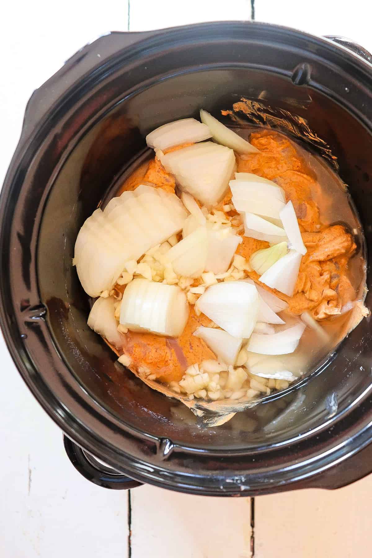 chicken shawarma with onion in crock pot.