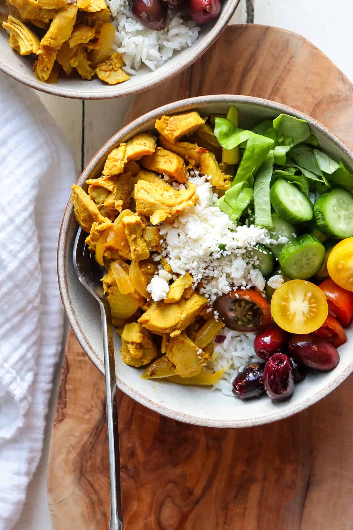 Bowl of chicken shawarma with vegetables and greek yogurt.