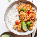 plated slow cooker chicken satay with toppings.