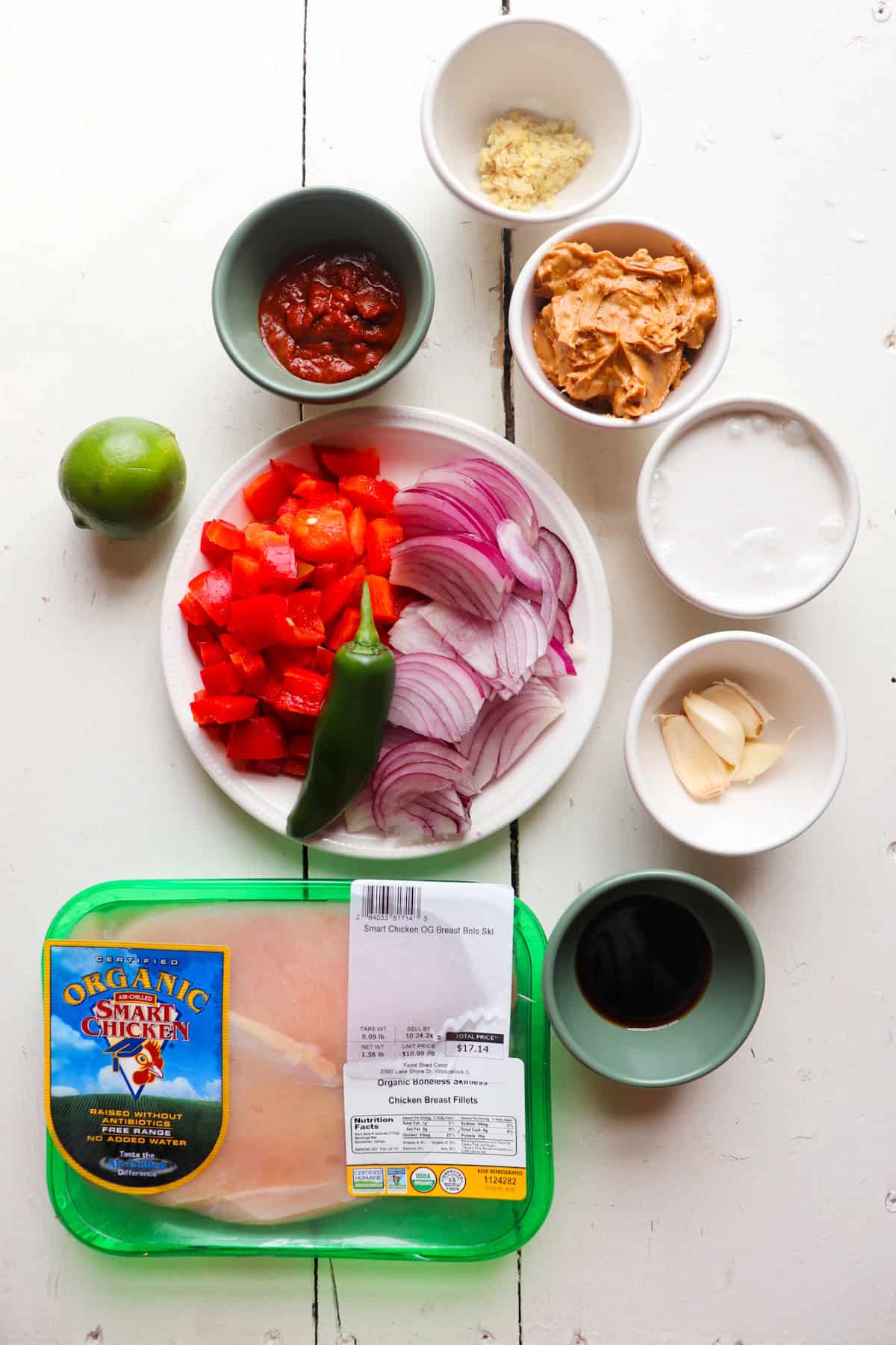 ingredients for slow cooker chicken satay on a white table.