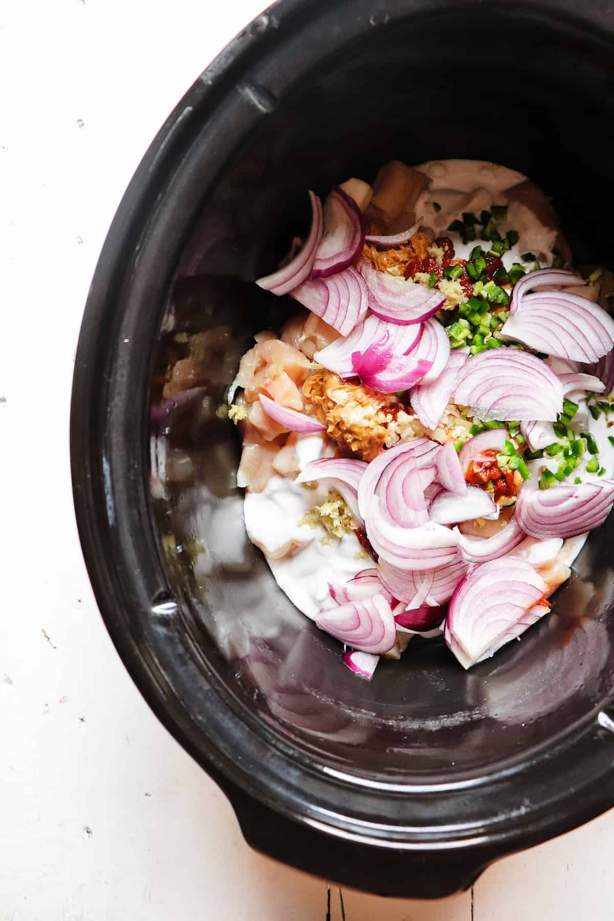 all ingredients added to slow cooker before cooking.